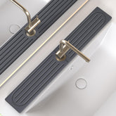 Telomet sink splash guard close-up shows fast drying diatomite performance.