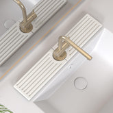 Telomet stone faucet mat closeup showing rapid absorption to reduce water mess.
