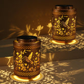 Tepaken hummingbird solar lantern garden decor provides warm outdoor ambiance.