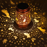 TIGGSY cat solar lantern pattern casts warm light for garden ambiance.