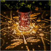TIGGSY Dragonfly solar lantern hanging outdoors creates a gentle evening ambiance.