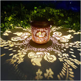 TIGGSY Squirrel Solar Lantern in a garden casting charming shadows at night