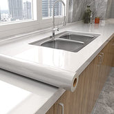 Tiltil glossy white wallpaper roll for quick cabinet updates.