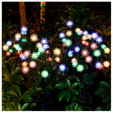 TONULAX solar garden lights with assembled flowers brighten walkways for evening gatherings.