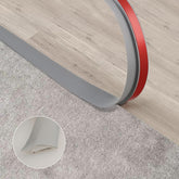 Trimold carpet-to-tile threshold in grey enables seamless transitions in high-traffic areas