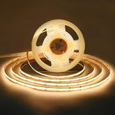 TUNICHX COB LED strip emits a warm white glow across a living room wall for cozy ambiance