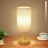 UCHENTON rechargeable cordless touch table lamp on a nightstand, offering portable warmth.