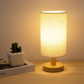 UCHENTON bedside lamp with wood base close-up highlighting sturdy construction for cozy lighting.