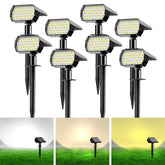 Ugecl solar spot lights illuminate a manicured lawn with easy stake installation.
