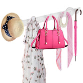 ULIBERMAGNET white coat rack with five hooks mounted on metal surface for clutter-free entryways.