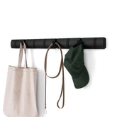 Umbra Flip 8-hook coat rack installation view with hidden hardware for clutter-free entryways.
