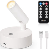 URTOM Wireless LED Spotlight uplights a wall art piece for subtle room ambience.