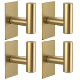 VAEHOLD gold wall towel hook showing strong adhesion on a smooth surface.
