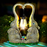Vereemy two elephants playing statue adds warmth to your garden.