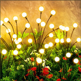 Vignuto solar firefly garden lights 2-pack illuminate outdoor spaces with a warm, romantic glow.