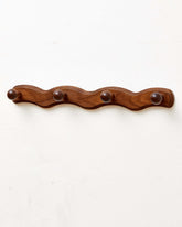 Vinoil wall-mounted walnut coat rack adds elegant entryway storage