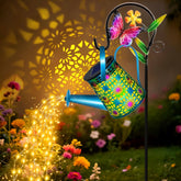 VOOKRY solar watering can lights with blue star flower decor illuminate gardens at night.