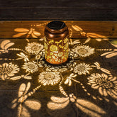 WACLSTDAY sunflower dragonfly lantern metal casts warm garden patterns.