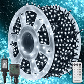 Waterglide 1000 LED lights on green wire illuminate outdoor spaces with a warm festive glow