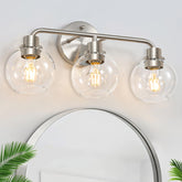 Watyo 3-light vanity fixture front view shows brushed nickel finish and glass shades for bright reflections.