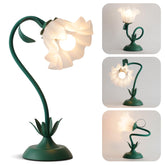 WERFOP Flower Table Lamp with soft green hue enhances cozy bedside ambiance.