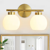 Wynterhaven two-light vanity light in brushed gold brightens the bathroom vanity.