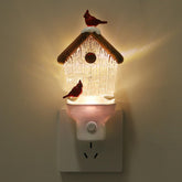 Xanqinluma Christmas Birdhouse Night Light at outlet, festive glow without blocking the second socket.