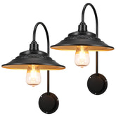 XIFEINIU solar barn lights 2-pack on exterior wall providing durable outdoor illumination