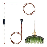 XZHGCEE green glass pendant light over the kitchen island provides ambient task lighting.