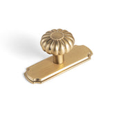 Yanxia elegant Bloom knob with champagne bronze backplate on a cabinet.