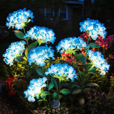 YAODEMA garden lights with blue hydrangea flowers illuminate a nighttime path.