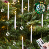 Yeelida flickering remote candles on tree create cozy glow.