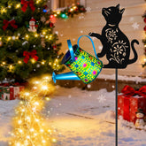Yulloyello Black Cat solar watering can light on blue metal hanging lantern for outdoor ambiance.