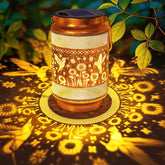 Yulloyello hummingbird lantern in gold bronze casts warm garden glow for patios at night.