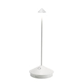 Zafferano Pina Pro lamp on charging base for cordless use.