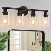 Zarbitta 4 light fixture over mirror with clear glass shades for refined vanity lighting