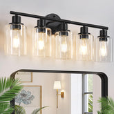 Zarbitta 5-light vanity fixture in matte black with clear glass shades brightens modern bathrooms.
