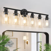 Zarbitta 6-light vanity fixture with matte black finish and clear glass shade for modern bathrooms.