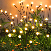 ZFNN solar firefly light ground stake illuminates garden paths with warm, inviting glow.