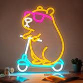 Zidoni Capybara Neon Sign with scooter on wall adds playful decor to kids' rooms.