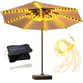 ZNYCYE solar umbrella lights glow warmly on a patio umbrella for cozy evenings.