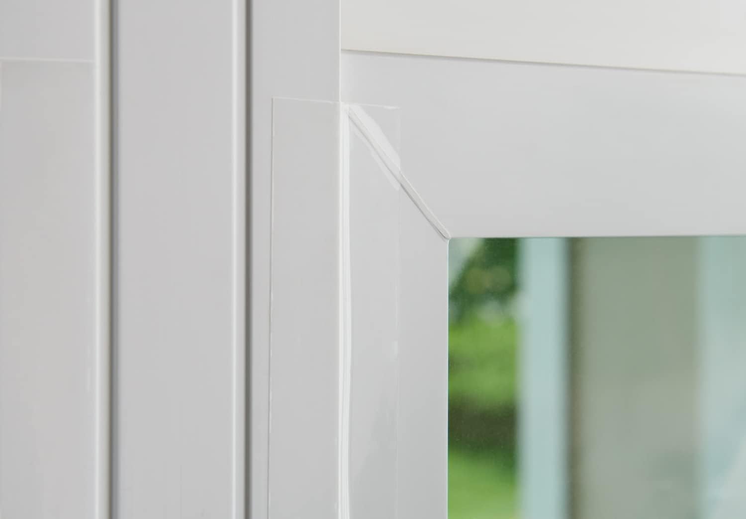 3M tape on a window seals gaps and preserves natural light.