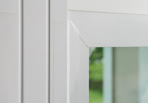 3M tape on a window seals gaps and preserves natural light.