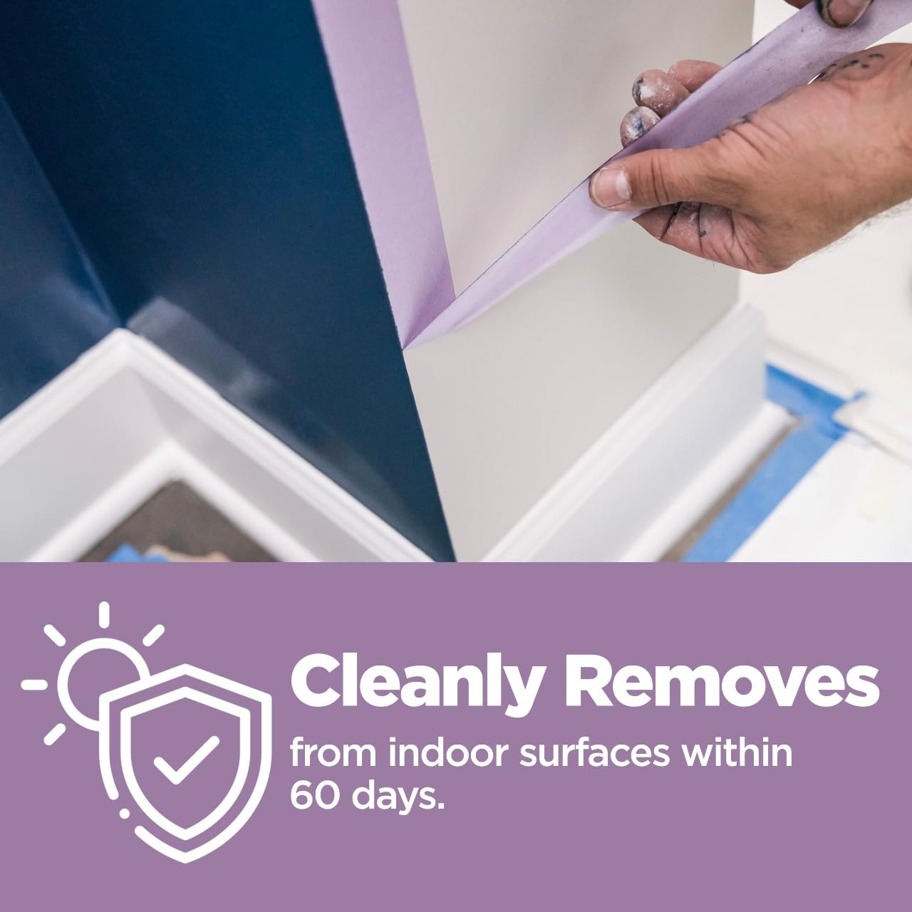 3M ScotchBlue tape applied to wallpaper edges to prevent damage during painting
