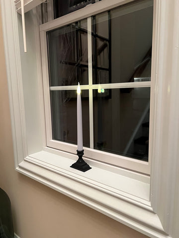 612 Vermont elegant night-time window display with ambient glow.