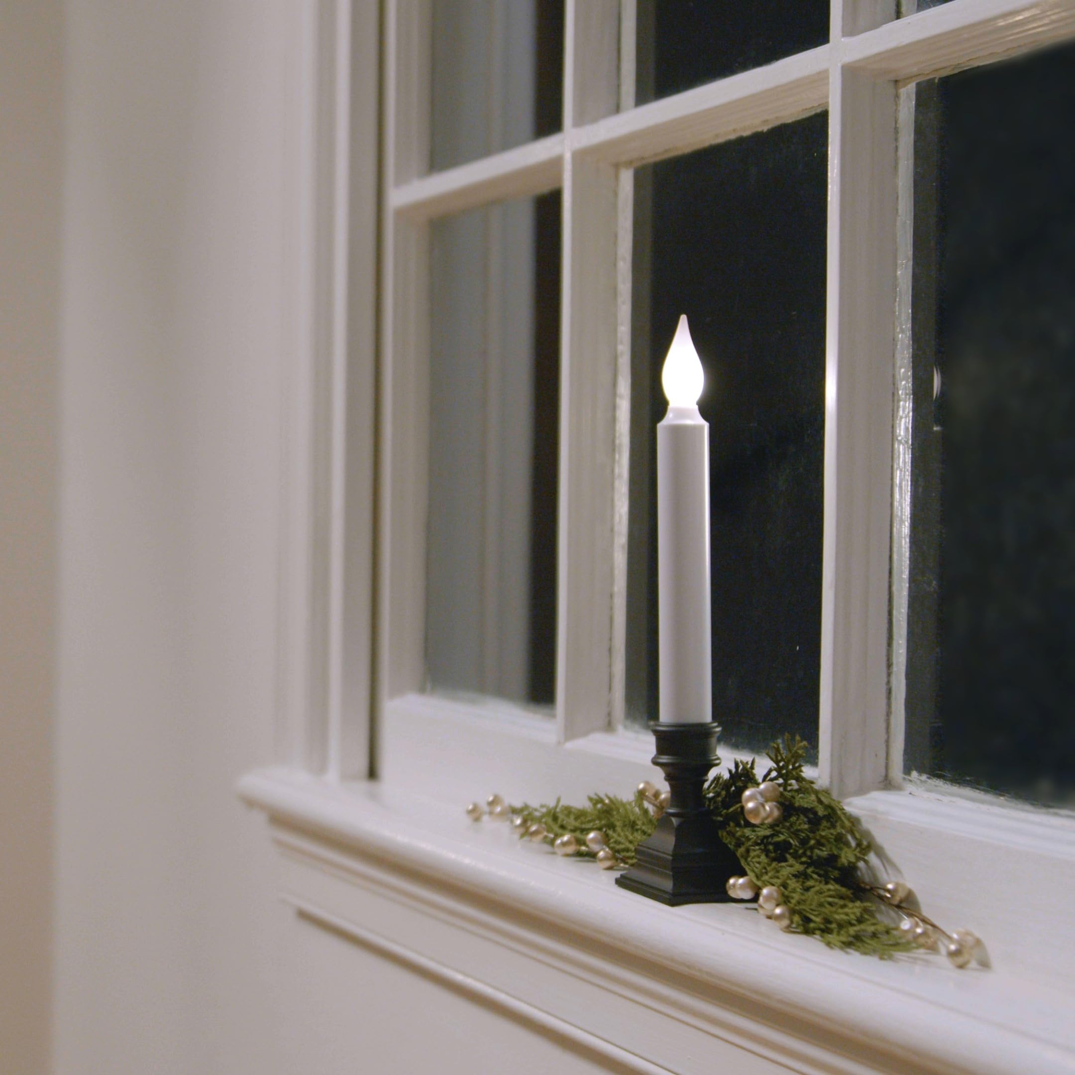 612 Vermont LED window candle shown in dusk exterior glow