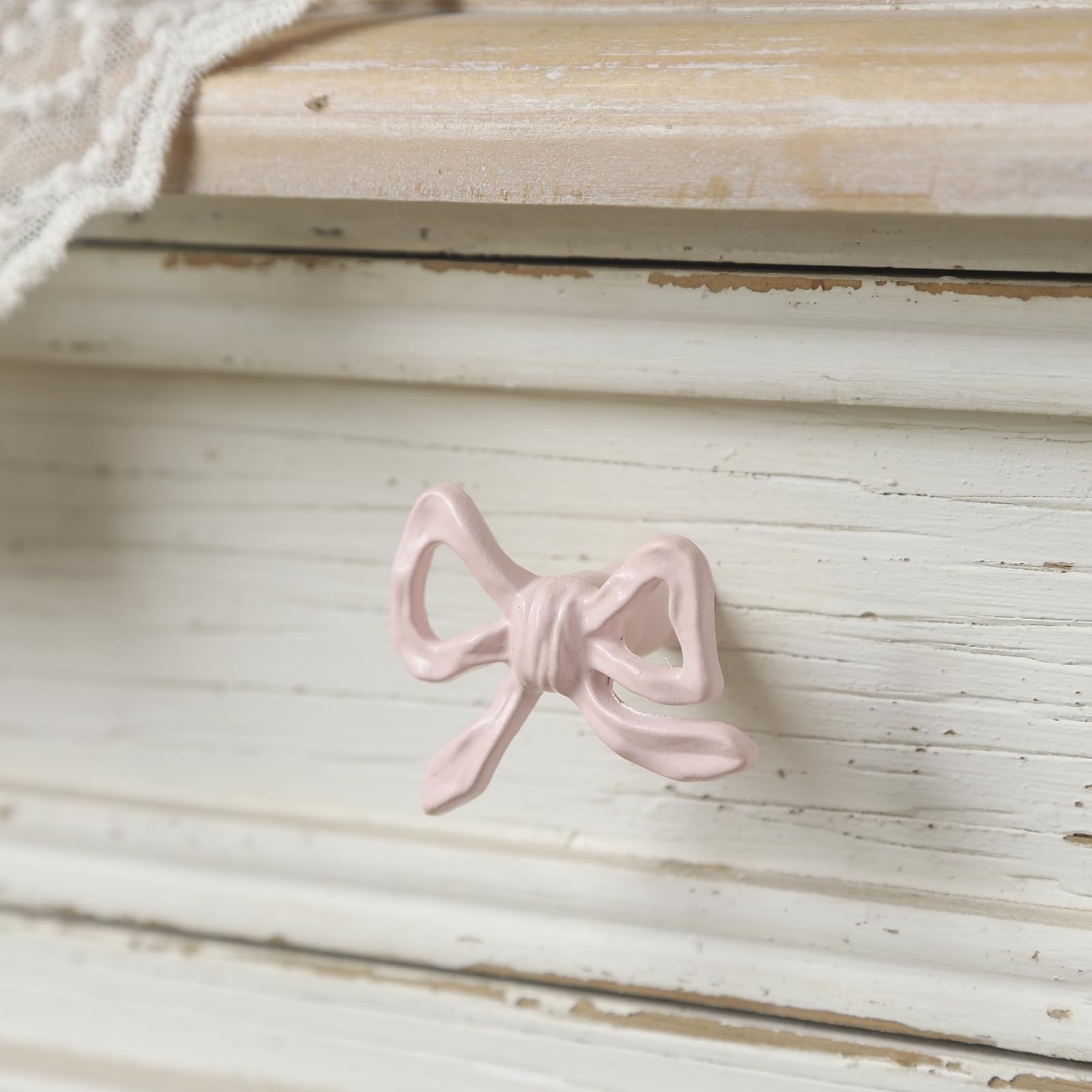 6 Funpop pink bow knob side view shows compact size for versatile furniture