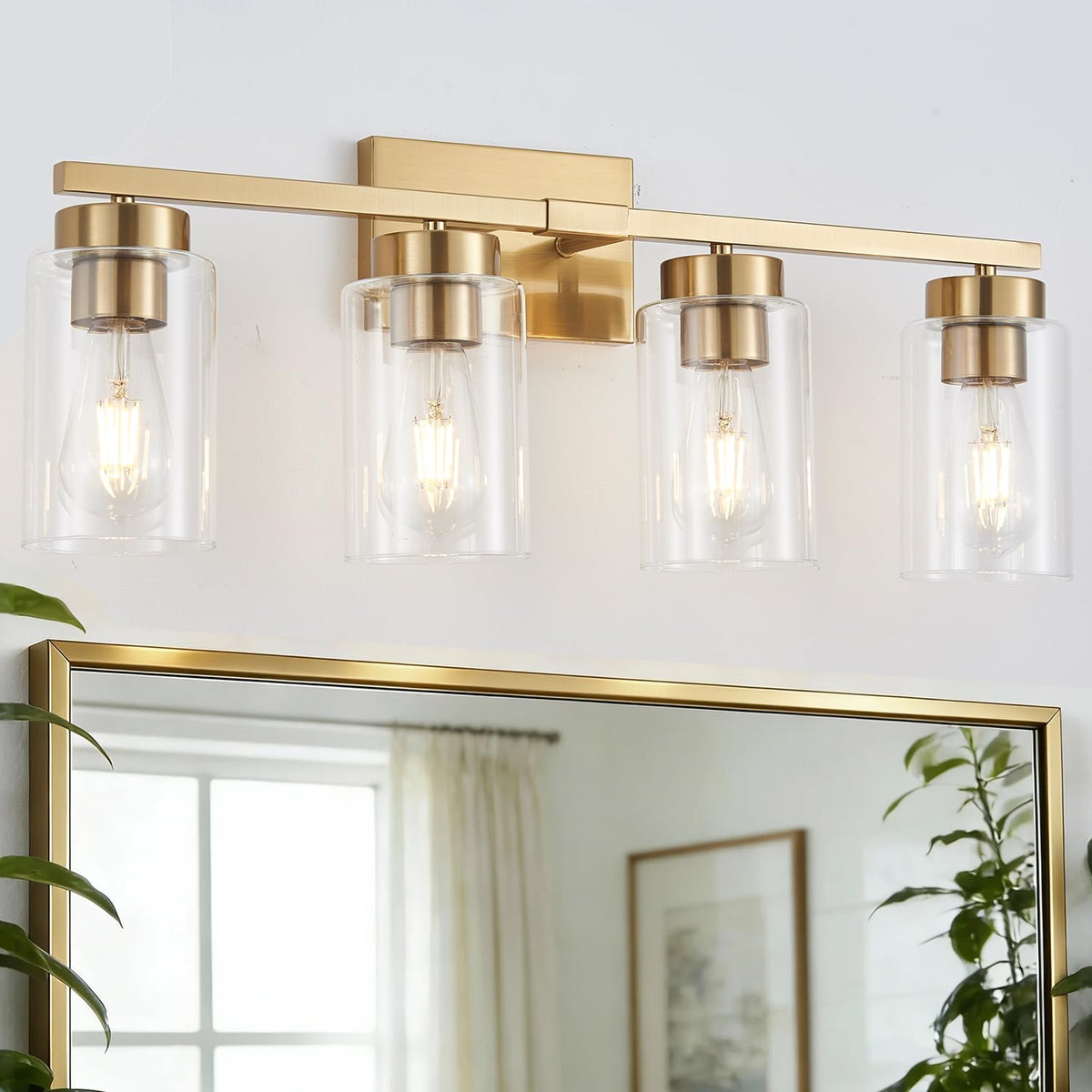 A1A9 4-light bathroom fixture with gold finish and clear glass shades, ideal for above mirrors.
