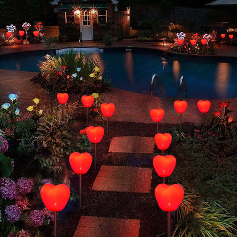 Abkshine solar heart lights emit a soft warm LED glow at dusk