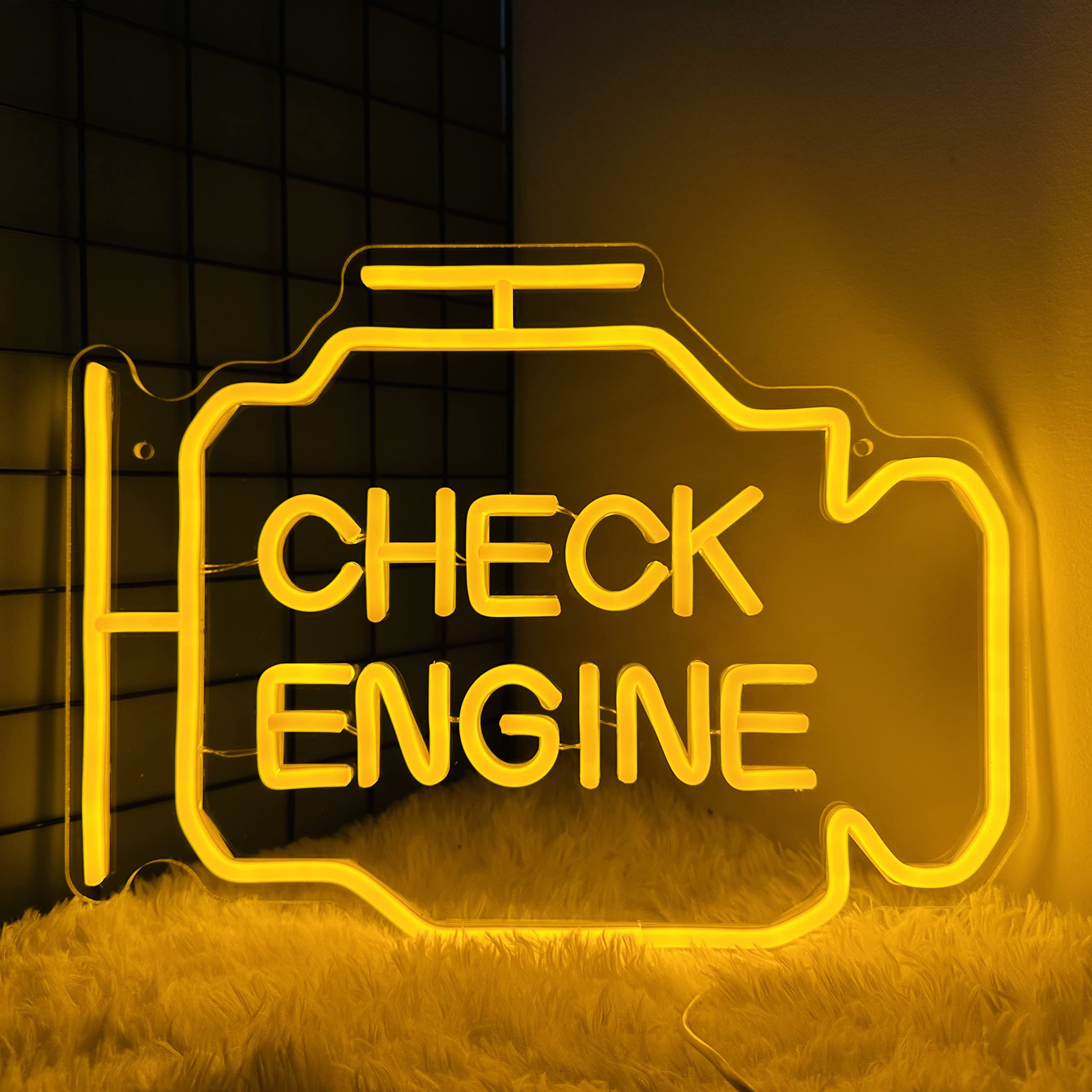 Abooly Check Engine Light Neon Sign mounted above a workbench with warm yellow glow for garage ambiance
